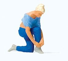 Woman Tying Her Shoes