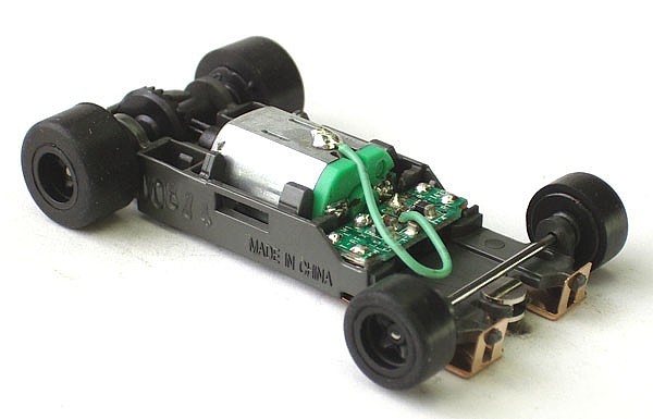 SCALE MEGA G TOMY AFX H.O 1.7 NARROW CHASSIS WITH BLACK RIMS SEE DETAILS 