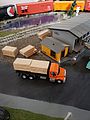 International(R) 7600 3-Axle Orange Flatbed Truck
